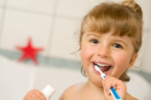 the girl is brushing teeth