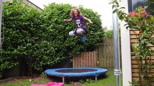 kid jump on trampoline